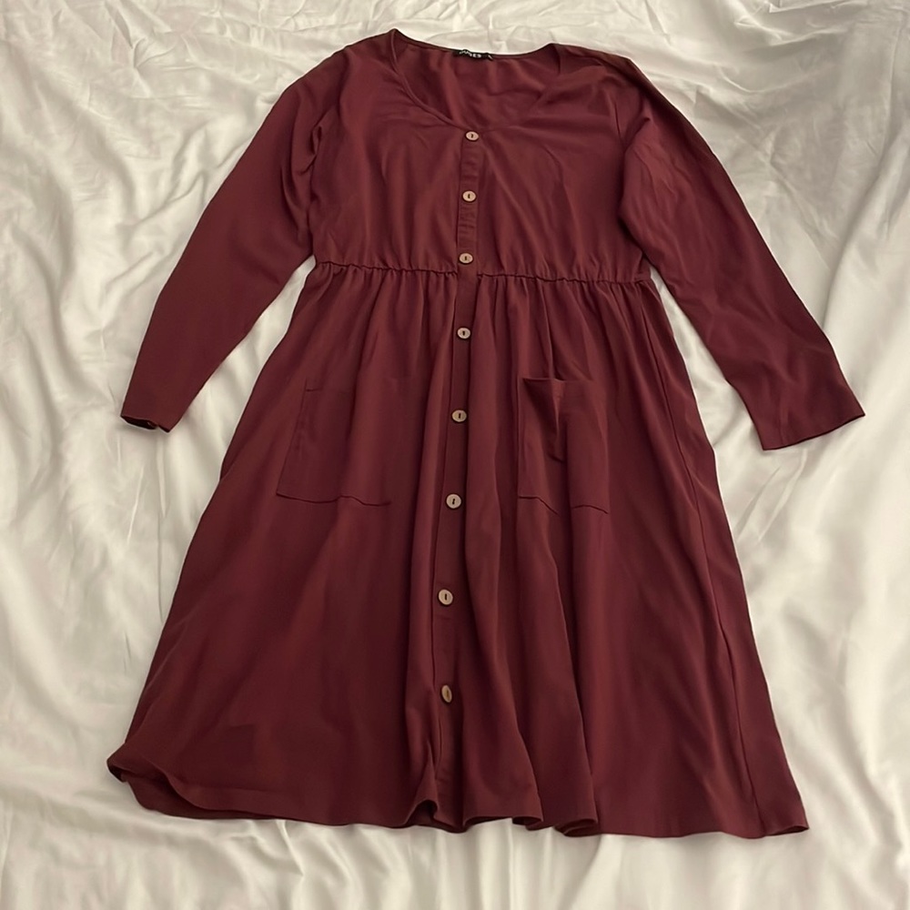 Maroon knee length long sleeved dress with buttons down front